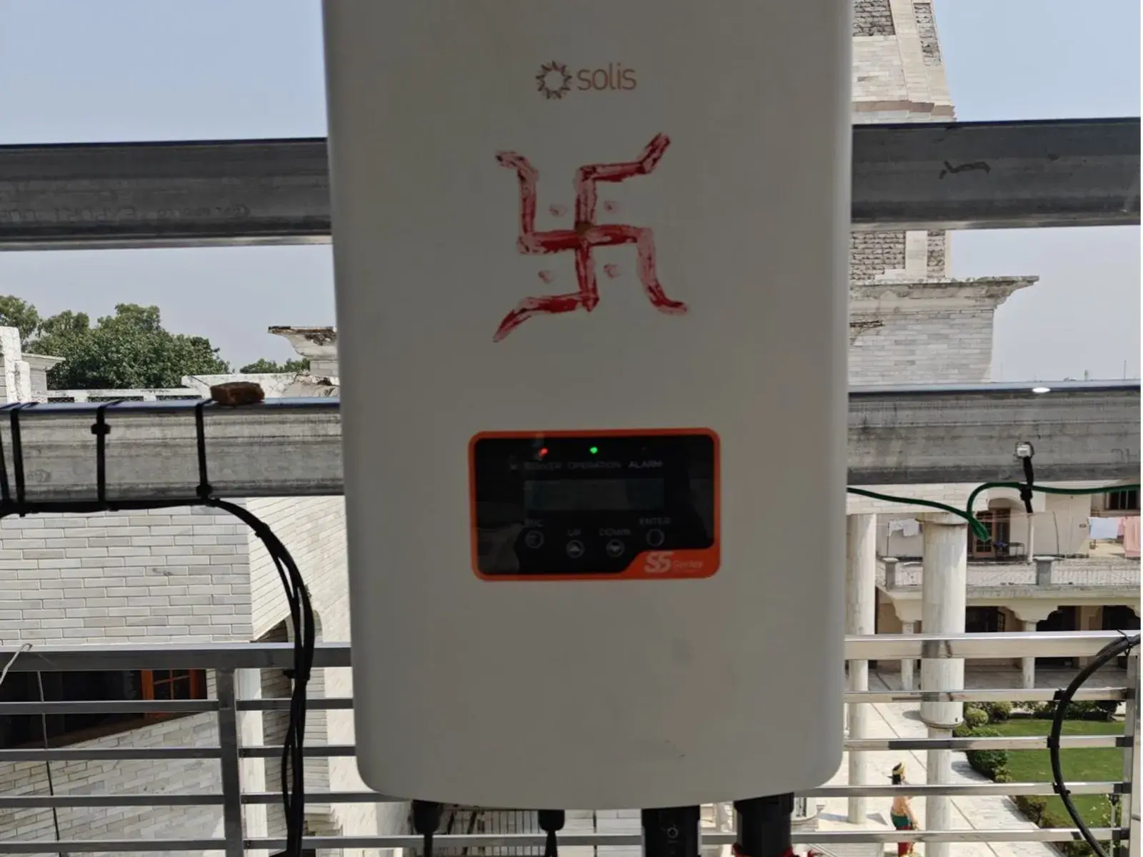 Solis inverter mounted on the rooftop railing